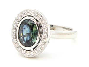 1.65 Carat Oval Cut Teal Blue Sapphire and Diamond Engagement Ring